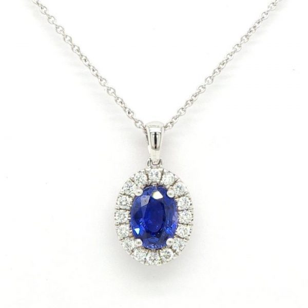 Sapphire and Diamond Oval Cluster Pendant; central 1.08ct oval faceted sapphire surrounded by 0.19cts brilliant cut diamonds, 18ct white gold