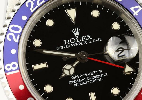 Rolex GMT Master 16700 Stainless Steel 40mm Automatic Watch, black dial, Pepsi red and blue rotating bezel, 24 hour hand, date indicator and sapphire crystal. Stainless steel Oyster bracelet. With Rolex box and papers. Purchased in 1996.