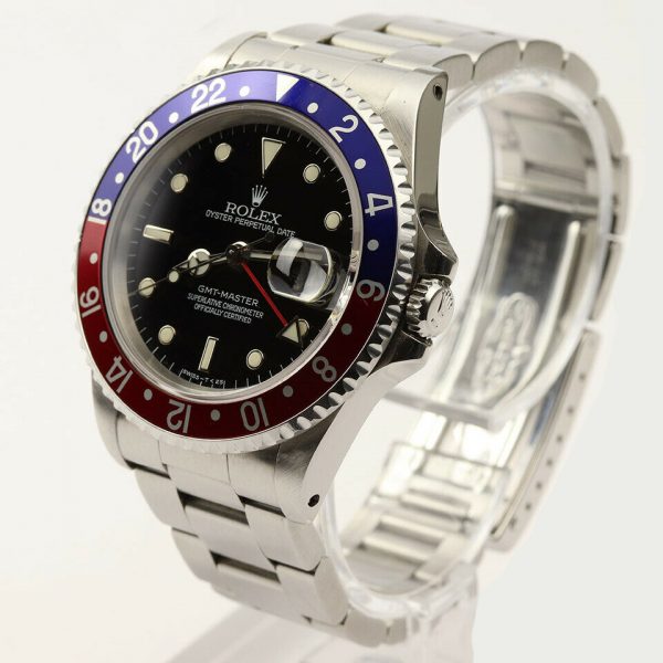 Rolex GMT Master 16700 Stainless Steel 40mm Automatic Watch, black dial, Pepsi red and blue rotating bezel, 24 hour hand, date indicator and sapphire crystal. Stainless steel Oyster bracelet. With Rolex box and papers. Purchased in 1996.