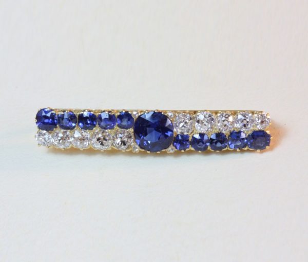 Antique Victorian Natural Sapphire and Old Cut Diamond Bar Brooch; set with old cut diamonds and natural untreated sapphires, 18ct yellow gold, 19th century.