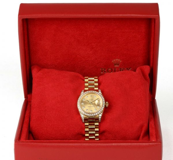 Rolex Oyster Perpetual 26mm Datejust 18ct Yellow Gold and Diamond Ladies Automatic Wrist Watch, Model 179158, factory set diamond bezel and lugs, screw-down Rolex crown, 18ct Rolex President bracelet with a single deployment clasp. With Rolex box and papers, Circa 2006/2007