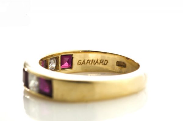 Garrard Princess Cut Ruby and Diamond Half Eternity Ring, 0.64ct princess-cut rubies and 0.48cts princess-cut diamonds, in 18ct Yellow Gold