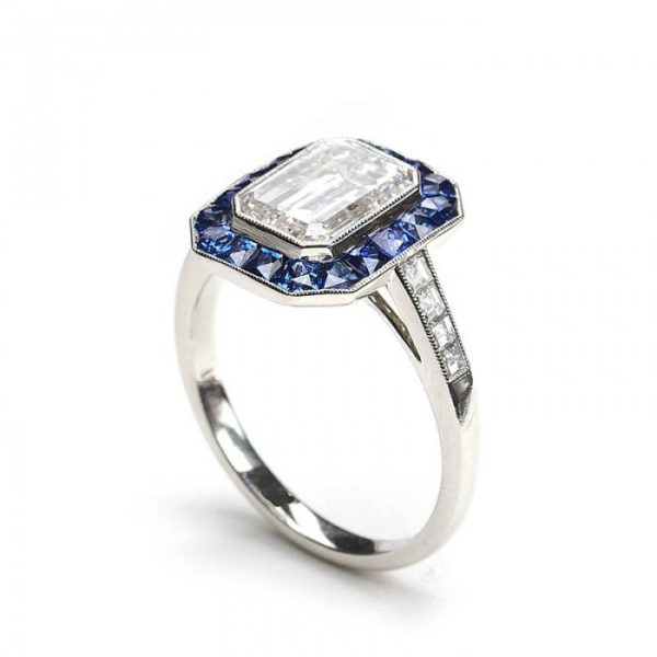 2.01ct Emerald Cut Diamond and Sapphire Cluster Ring; F colour, VS2 clarity, square-cut diamond set shoulders. Set in platinum