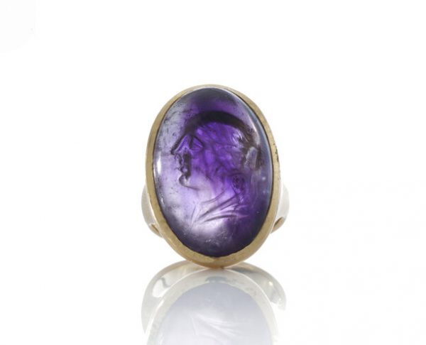 Ancient Carved Amethyst Ring of Berenice, 20.00 carats, produced 300BC-200BC, mounted in a later 18ct gold circa 1980's.