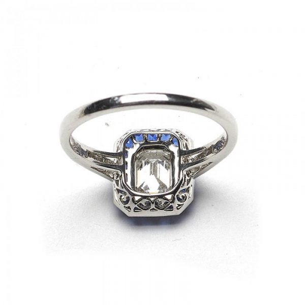 0.69ct Emerald Cut Diamond and Sapphire Cluster Ring, E VS2, Square-cut diamond set shoulders, mounted in platinum