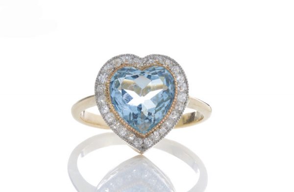 Edwardian Style Aquamarine and Diamond Heart Shaped Cluster Ring; 6.00ct heart cut aquamarine surrounded by 0.52cts rose-cut diamonds, 18ct yellow gold