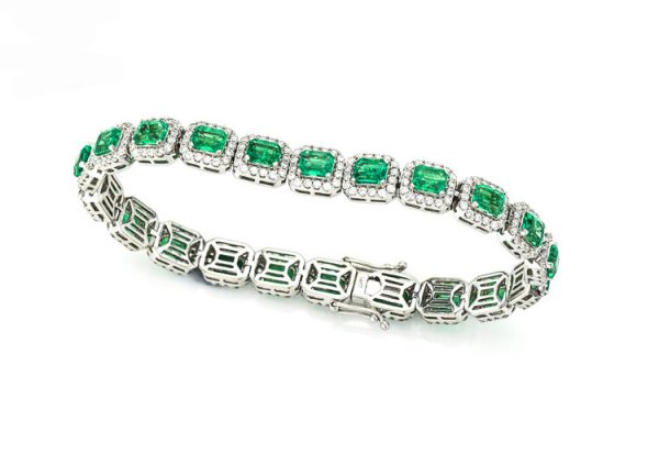 Colombian Emerald and Diamond Cluster Bracelet; featuring 9.02cts emerald-cut emeralds and 3.00cts brilliant cut diamonds, in 14ct White Gold