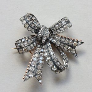 Antique Victorian Old Cut Diamond Double Bow Brooch, 3.40 carat total, set in silver and backed with gold, England, Circa 1880.
