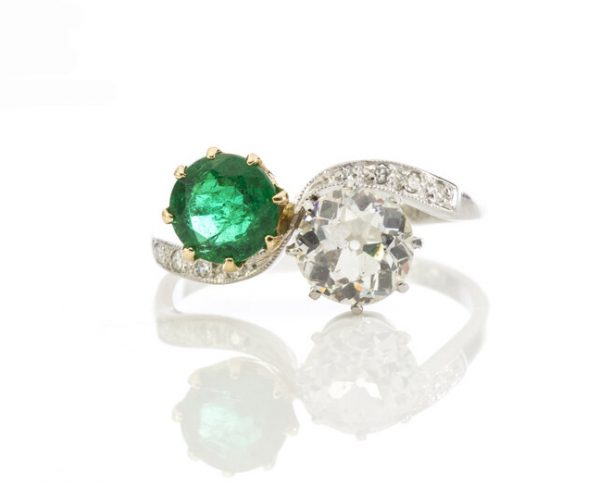Natural Colombian Emerald and Diamond Crossover Ring in Platinum; set with 1.00ct natural emerald and 1.50ct old cut diamond, diamond set shoulders