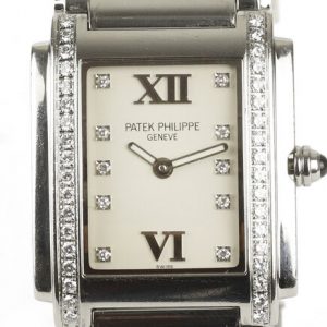 Patek Philippe Twenty-4 Stainless Steel 4910 Ladies 25mm Diamond Dial Quartz Rectangular Watch, white dial, diamond dot hour markers and Roman numerals, diamonds set to each side of the dial, blue cabochon gem set crown, Patek stainless steel bracelet with a hidden double deployment clasp.