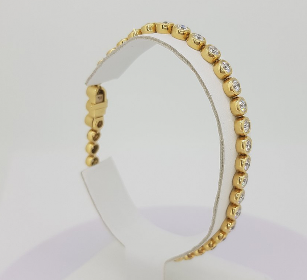 bracelet yellow gold diamond line rubover bezel