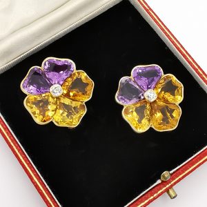 Vintage Citrine Amethyst and Diamond Pansy Flower Stud Earrings; with shaped citrines and amethysts, and old cut diamond centre. Circa 1975
