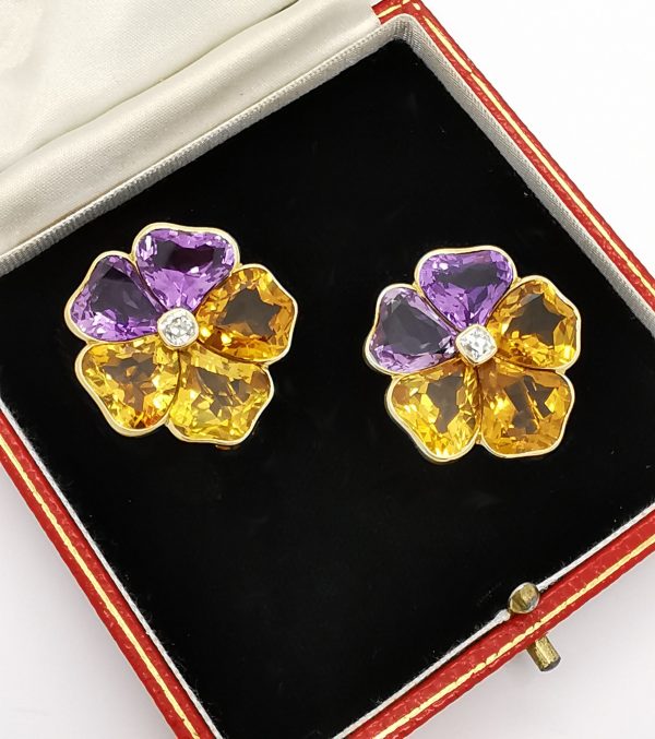 Vintage Citrine Amethyst and Diamond Pansy Flower Stud Earrings; with shaped citrines and amethysts, and old cut diamond centre. Circa 1975