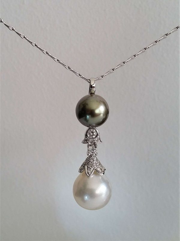 Tahitian Pearl, South Sea Pearl and Diamond Pendant; 11mm grey Tahitian pearl, 13mm South Sea Pearl and 0.35ct diamonds, 18ct white gold chain