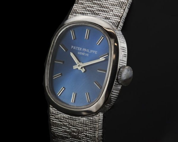 Patek Philippe Mini Ellipse 18ct White Gold Ladies Vintage Manual Watch, Ref 4226, sunburst blue dial, on an 18ct Patek Philippe bracelet strap, Circa 1980