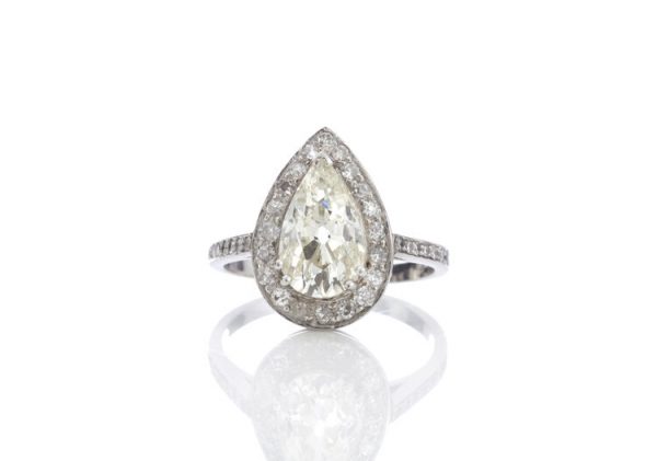 Contemporary 2.40ct Diamond and Platinum Pear Shaped Cluster Ring; a 2.40 carat pear-cut diamond with diamond halo, with GCS certificate.