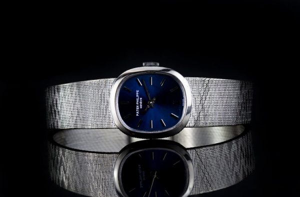 Patek Philippe Mini Ellipse 18ct White Gold Ladies Vintage Manual Watch, Ref 4226, sunburst blue dial, on an 18ct Patek Philippe bracelet strap, Circa 1980s