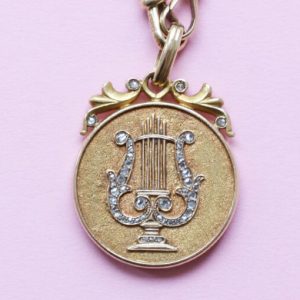 Art Nouveau Rose Cut Diamond Gold Lyre Locket Pendant; decorated with a lyre in rose cut diamonds, in original case. American, Circa 1900