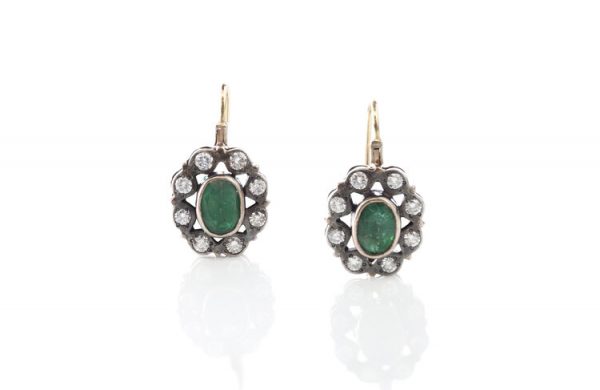 Antique Victorian Emerald and Diamond Oval Cluster Drop Earrings; 2.00cts emeralds surrounded by 0.80cts diamonds, in silver and gold. Circa 1870s