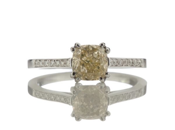 Cushion Cut Fancy Yellow Diamond Engagement Ring, 1.24 carats, diamond set shoulders, with certificate. Circa 1990s.