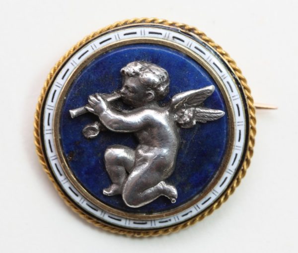 Fanniere Freres Circular Angel Brooch; circular brooch depicting an angel on central blue hardstone, surrounded by white enamel detail
