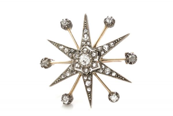 Antique Victorian Old Cut Diamond Star Brooch; set with rose cut and old European cut diamonds, 0.88 carat total, set in silver and 15ct gold