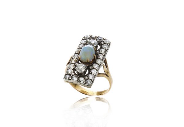 Antique Opal and Old Cut Diamond Panel Ring in 18ct gold; central 1ct cabochon oval opal surrounded by 1.76cts old cut diamonds in an openwork setting