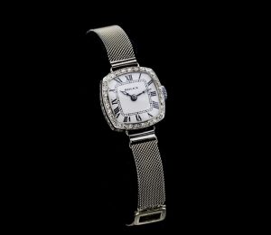 Rolex Art Deco Ladies Diamond Set 18ct White Gold Watch; 18ct Rolex case set with rose-cut diamonds, on a 9ct white gold mesh strap, case hallmarked R.W.C LTD Rolex watch company limited, London import date stamped 1926 and 18ct gold hallmark.