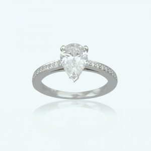 1.01ct Pear Cut Diamond Engagement Ring; central 1.01 carat pear-shaped diamond, claw-set, diamond set shoulders. Mounted in platinum.