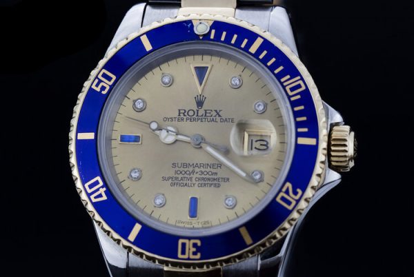 Rolex 16803 Submariner in Gold and Steel with 40mm Tropical Serti Dial Automatic Watch, diamond and sapphire set dial, quickset display date window, Circa 1990s