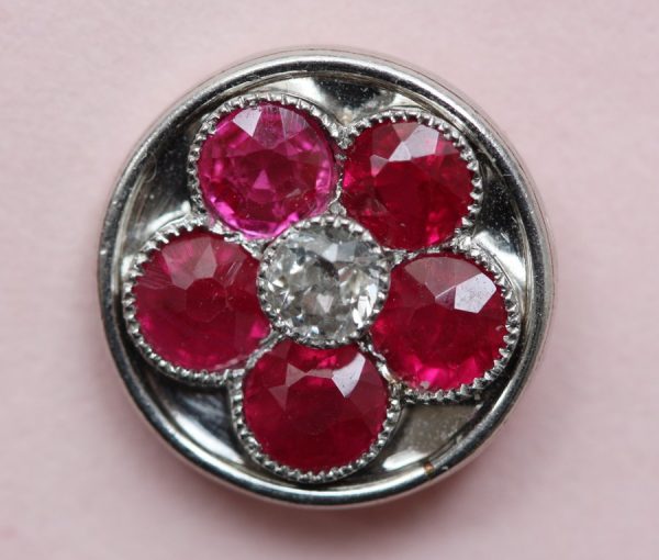 Art Deco Ruby, Diamond and Platinum Cufflink Dress Set; decorated with rubies around central diamond creating a stylish floral design