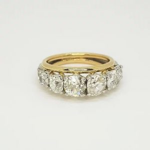 Vintage 1960s Bespoke 2.50ct Old Cut Diamond Ring; featuring eleven graduated old-cut diamonds that taper to the shoulders, in open white gold collet settings, edged with 18ct yellow gold