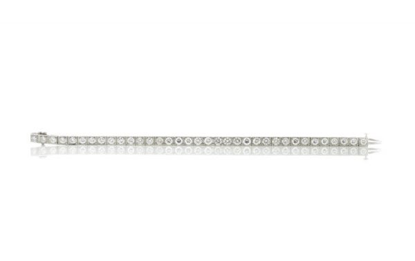 Cartier Vintage Diamond and Platinum Tennis Bracelet, 5.25 carat total, with Cartier box. Circa 1950s