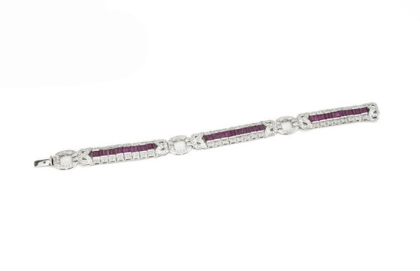 Vintage Ruby and Diamond Bracelet, 2.40cts baguette-cut rubies surrounded by 2.71cts diamonds, diamond set circular links, Circa 1990's.