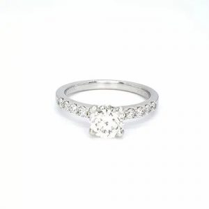 Diamond Solitaire Engagement Ring; round brilliant cut diamond, claw-set, accented with diamond set shoulders, 1.01 carats, in platinum