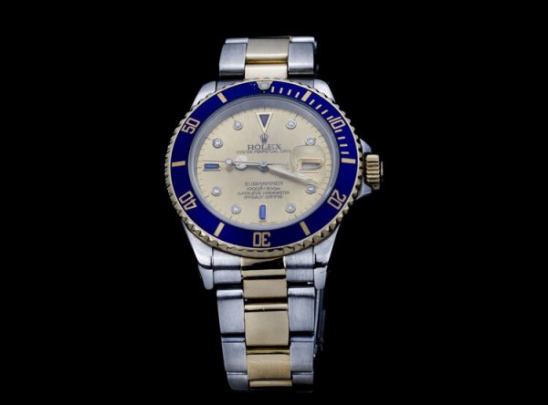 Rolex 16803 Submariner in Gold and Steel with 40mm Tropical Serti Dial Automatic Watch, diamond and sapphire set dial, quickset display date window, Circa 1990s