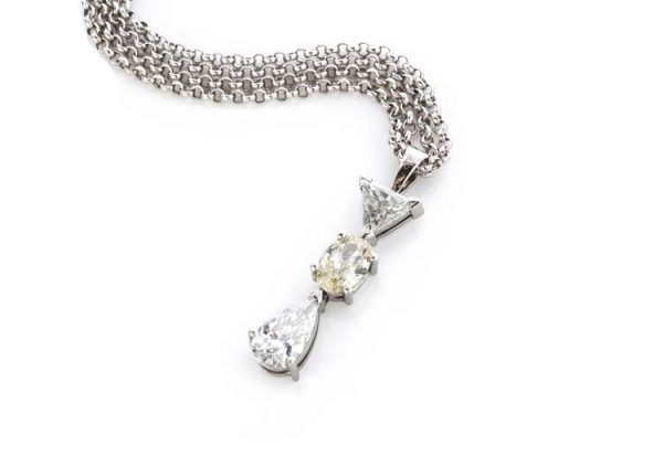 Filk Italian Diamond Drop Pendant Necklace, 1.55cts, oval fancy yellow diamond, triangular and pear-cut diamond, VVS clarity, F colour, Circa 1990's