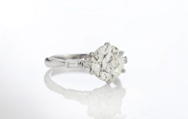 Art Deco Diamond and Platinum Engagement Ring; 3.02ct old European cut diamond with baguette-cut diamond-set shoulders, with GCS certificate