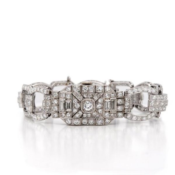Art Deco 7ct Diamond and Platinum Bracelet Cocktail Watch; diamond bracelet with diamond set sliding panel revealing watch face, 7.00 carats, Circa 1930