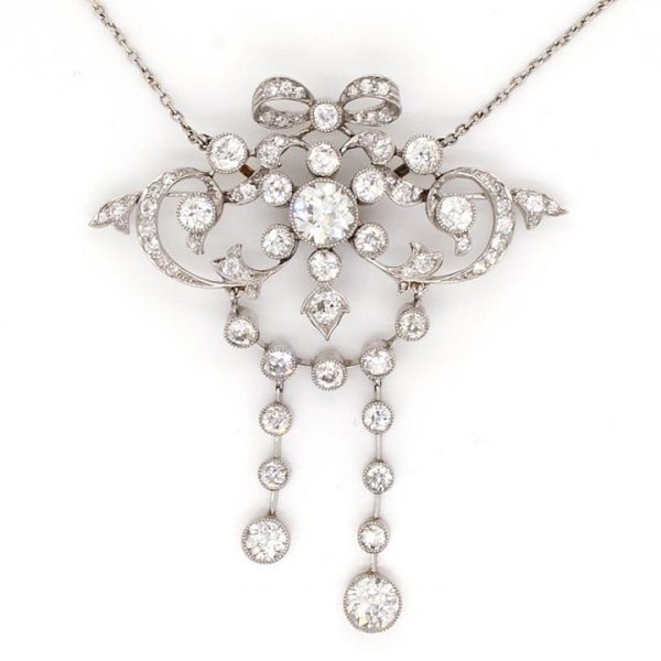 Art Nouveau 3.50ct Diamond and Platinum Ornate Bow Pendant; openwork ornate bow design set with diamonds, 3.50 carat total, Circa 1910