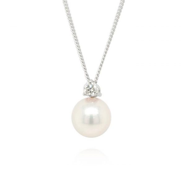 Pearl and Diamond Pendant on 18ct White Gold Chain; featuring a large cultured pearl with claw-set 0.10ct round brilliant-cut diamond above