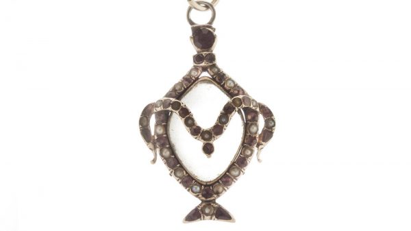 Antique Georgian Rock Crystal, Ruby and Pearl Locket Pendant; central rock crystal locket surrounded with rubies and seed pearls. Made in England, 18th century, Circa 1760s