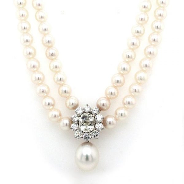 Stunning two row cultured pearl necklace featuring an 18ct white gold and 2.45ct diamond cluster with a large single South Sea Pearl drop