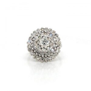 Vintage 1.20ct Diamond Cluster Bombe Cocktail Ring; The domed top is encrusted with 45 sparkling brilliant cut diamonds; 44 of which are set in a circular display around the central 0.35 carat diamond, in 18ct white gold