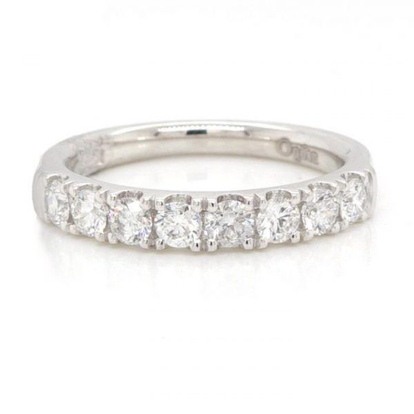 Diamond and Platinum Half Eternity Ring; scallop-set with eight round brilliant cut diamonds, 0.74 carat total