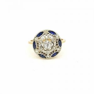 Vintage Sapphire and Diamond Circular Star Cluster Ring; central diamond surrounded by marquise-cut sapphires and round-cut diamonds, star design, pierced mount, in 18ct yellow gold