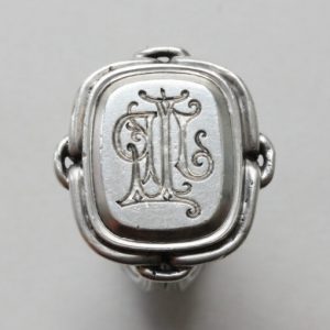 19thC French Neo Renaissance Silver Desk Seal Ring; presse papier ring, quatrefoil bezel set with octahedron diamond, animal mouths to shank, Circa 1870