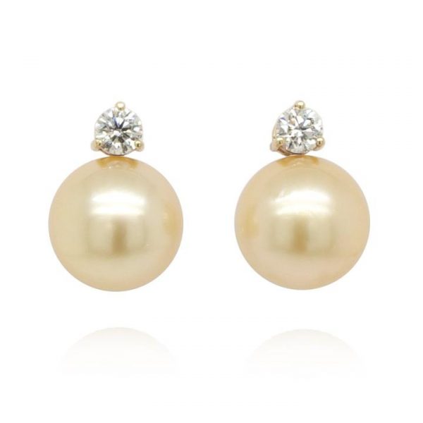 Golden South Sea Pearl and Diamond Earrings; featuring beautiful 11.60mm South Sea golden pearls with 0.52cts diamonds claw-set above, in 18ct yellow gold