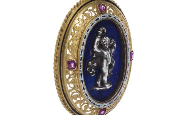 Antique Italian 18ct Yellow Gold Pendant in the style of Castellani; featuring a silver cherub on lapis lazuli, in 18ct pierced surround accented with rubies, Circa 1850-1870s