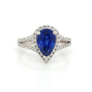 Pear Shaped Sapphire and Diamond Cluster Ring; central 2.46ct pear-shaped faceted sapphire surrounded by brilliant cut diamonds, with split diamond-set shoulders